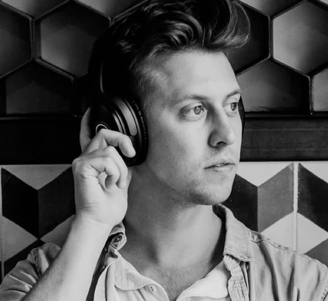 A listener enjoying over-ear headphones